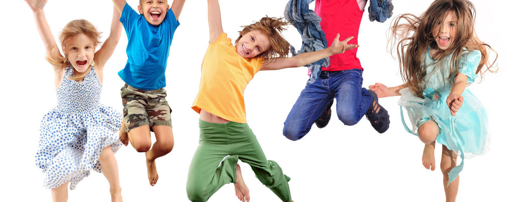 group of happy cheerful sportive children jumping and dancing